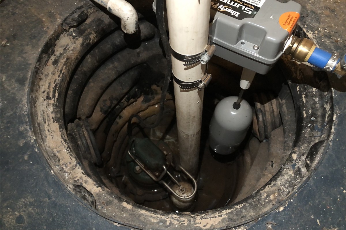 An installed basement sump pump.